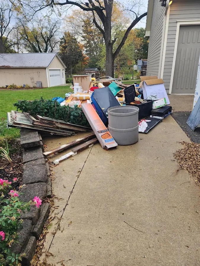 Dumpster being loaded with debris for 30 Yard Dumpster Rental in West Pikeland